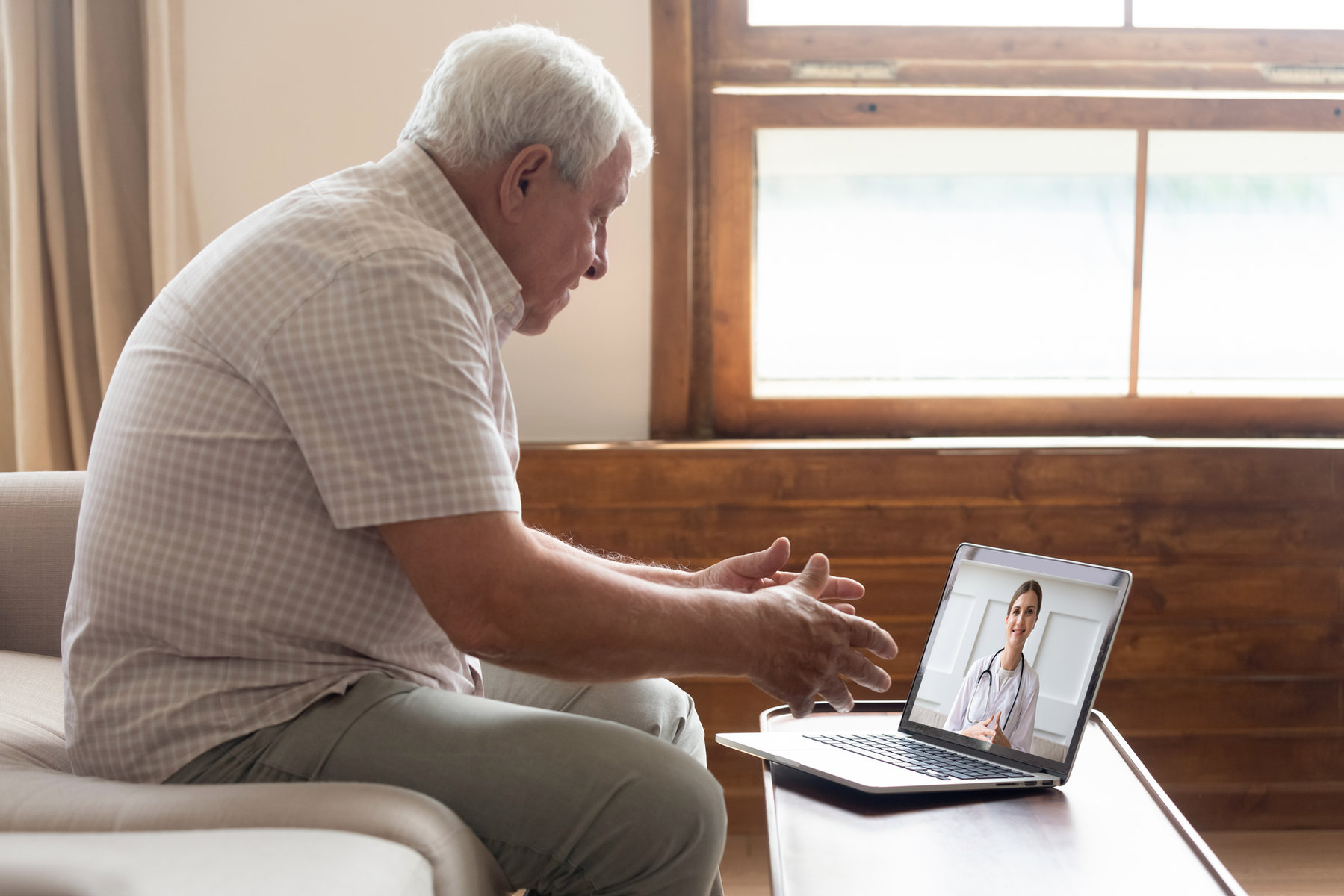 Man on a video consultation from home